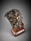 La tête de saint Jean-Baptiste by Karel Schuermans, Bronze à patine brun nuancé, sold Feb 2026