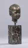 Tête d'enfant by Arno Breker, Epreuve en bronze à patine brune, sur un socle cubique en marbre portor, sold Dec 2017