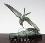 An Art Deco bronze figure of a sea bird swooping over waves by Irénée Rochard, bronze, sold Mar 2016