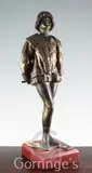 A patinated bronze figure of a renaissance swordsman, on simulated marble plinth, height 21in., replacement plinth by Léon Delagrange, bronze, sold Mar 2016