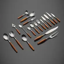 Fjord flatware by Jens Quistgaard, 1953, teak, stainless steel, sold Apr 2022