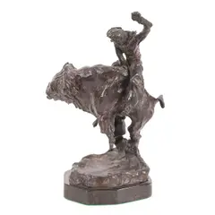 Untitled by Noah Beery Jr, bronze depicting a buffalo rider on marble base. Signed at base. Dimensions: 11, offered May 2024