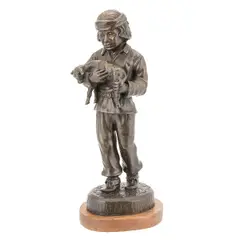 Untitled by Bettie J. Moran, bronze figure of a young male holding a puppy (or lamb). Signed and numbered at base, offered Sep 2023