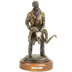 Untitled by Rick Taylor, bronze of an Asian man holding an animal skull, offered Oct 2022