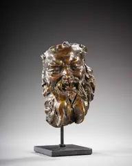 Masque de Silène by Jules Dalou, Bronze à patine brun nuancé, sold Sep 2025