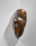 Double masque by Jean Lambert-Rucki, Bronze à patine brune, sold Apr 2024