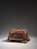 Coffret à cigares by Charles-Guillaume Diehl, Bronze à patine brune et bois fruitier à décor de têtes de dragons, salamandres et serpents, sold Nov 2024