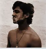 My Assistant Smokes a Beedi - Hampi by Waswo X. Waswo, Sepia toned silver gelatin print on paper, sold Jul 2012