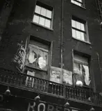 Façade [Consult Gypsy Palmist] - Whitehall (Westminster) - Kew Gardens - Dock Cranes - Londres, 1934 by dite Dora Maar Henriette Theodora Markovitch, Cinq épreuves argentiques d'époque, tirées par contact, contrecollées sur pochettes en papier cristal,, sold Dec 2024