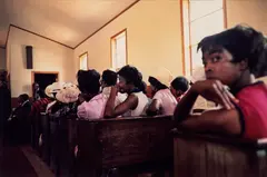 Como, Mississippi (Black women in church) by William Eggleston, 1972, Dye transfer print from Dust Bells Vol. I, printed 2004, sold Oct 2026