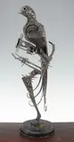 A large textured steel model of a parrot on a perch, with circular stepped base, 25.5in by Walenty Pytel, sculpture, sold Apr 2015