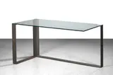 Bureau "Pierre Boulez by Andree Putman, 1988, Structure décentrée à trois pieds en lame d'acier patiné gris et plateau en verre sécurit, sold Jun 2023