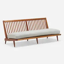 Settee by George Nakashima, c. 1970, American black walnut, upholstery, sold Mar 2022