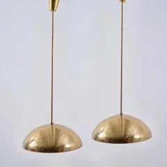 Zwei Deckenleuchten by Paavo Tynell, 1940, Messingblech, perforiert, innen weiß lackiert, Messingrohr (Taito Oy, Helsinki), sold Oct 2026