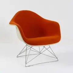Armlehnsessel 'LAR' - 'Cats Cradle' by Charles and Ray Eames, 1950, Fiberglasverstärkter Kunststoff, weiß, Metallstäbe, verchromt, Hopsack, orange (Vitra, Birsfelden für Herman Miller, Zee, sold Oct 2026
