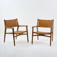 Zwei Armlehnsessel 'JH 516' by Hans J. Wegner, 1951, Eichenholz, Rattangeflecht (Johannes Hansen, Kopenhagen), sold Oct 2026