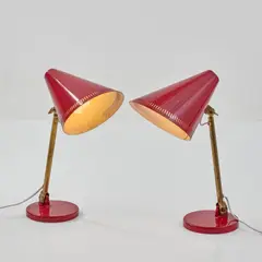 Zwei Tischleuchten '9222' by Paavo Tynell, 1950, (Messingrohr, Metallblech, rot lackiert), sold Oct 2026