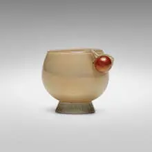 Incamiciato cup by Tomaso Buzzi, c. 1933, incamiciato glass with applied details, sold Mar 2022