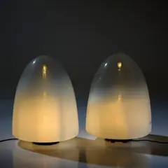Zwei Tischleuchten 'Ebe' by Giusto Toso, um 1970, Glas, farblos, opalweiß verlaufend, weißer Kunststoff bzw (Leucos, Mailand), sold Oct 2026