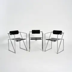 Drei Armlehnstühle 'Seconda' by Mario Botta, 1982, Metallrohr, Kantblech, silbergrau eloxiert, Lochblech, schwarz lackiert, Polyurethanrolle, schwarz (Alias, Bergamo), sold Oct 2026