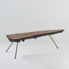 Baumstammtisch by Carl Auböck, um 1955, Baumstammanschnitt, Nussbaum, Messingrohr (Werkstätte Carl Auböck, Wien), sold Jun 2026