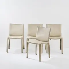 Vier Stühle 'Cab 412' by Mario Bellini, 1977, Metallrahmen, weißes Leder, schwarzer Kunststoff (Cassina, Mailand), sold Jun 2026