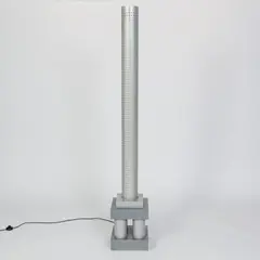 Stehleuchte 'Chicago Tribune' aus der Serie 'Stillight' by Matteo Thun, 1985, Metallrohr, Metallblech, Lochblech, grau lackiert (Bieffeplast, Padua), sold Jun 2026