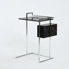 Beistelltisch 'Petite Coiffeuse' by Eileen Gray, 1927, Metallrohr, verchromt, Holzkastenkonstruktion, schwarz lackiert (ClassiCon, München, 1990er Jahre), sold Mar 2026