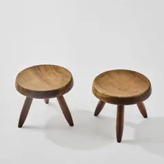 Zwei Hocker by Charlotte Perriand, 1938, Mahagoni (Georges Blanchon, Paris; Sentou, Paris; Steph Simon, Paris, ab 1946), sold Mar 2026