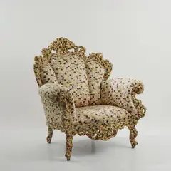Armlehnsessel 'Poltrona di Proust' by Alessandro Mendini, 1978, Holzrahmenkonstruktion, geschnitztes und vielfarbig in pointillistischer Manier bemaltes Holz, polychrom bedruckter Text, sold Mar 2026