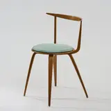 Stuhl 'Pretzel Chair' by George Nelson, 1952, Nussbaum, Schichtholz mit Nussbaumfurnier, Textilbezug, türkis (Herman Miller, Zeeland, 1950er Jahre), sold Dec 2025