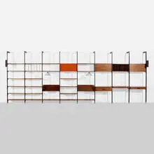 CSS (Comprehensive Shelving System) by George Nelson & Associates, 1959, enameled aluminum, aluminum, walnut, laminate, lacquered masonite, plastic, enameled steel, sold Jan 2022