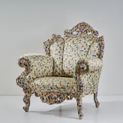 Armlehnsessel 'Poltrona di Proust' by Alessandro Mendini, 1978, Holzrahmenkonstruktion, geschnitztes und vielfarbig in pointillistischer Manier bemaltes Holz, polychrom bedruckter Text, sold Oct 2024
