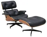 EAMES BLACK LEATHER LOUNGE CHAIR & OTTOMAN by Herman Miller, 2000, padded leather back and seat, sold Jun 2025