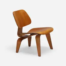 LCW by Charles and Ray Eames, walnut plywood, rubber, sold Jan 2022