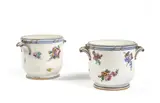 À décor polychrome de bouquets de fleurs et filets bleu et or, marqués, LL entrelacés, lettre-date F et R, marques de peintres Charles-Louis Méreaud et Nicolas Rousselle ; usures d'or et une égrenure by Deux, Two Sevres soft porcelain glass buckets, 18th century, dated 1759 and 1770, sold Sep 2022