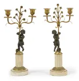 PAIRE DE CANDELABRES (ANCIENNE GARNITURE DE CHEMINEE) by Paire De Candelabres, En bronze à patine brune et marbre blanc, sold Oct 2022