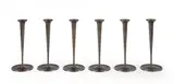 Six flambeaux by Kenzo Takada, En métal à patine noire, sold May 2021