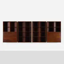 Wall-mounted bookcases, set of four by Aksel Kjersgaard, c. 1960, rosewood, brass, sold Nov 2021