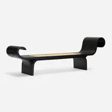 Marquesa bench by Oscar Niemeyer, c. 1974, lacquered wood, cane, sold Oct 2021