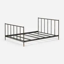 Full-sized bed by Jacques Adnet, c. 1950, saddle-stitched leather, brass, enameled steel, lacquered wood, sold Oct 2021