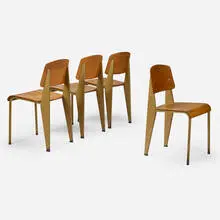 'Semi-Metal' chairs no. 305, set of four by Jean Prouvé, 1950, enameled steel, beech plywood, aluminum, rubber, sold Oct 2021