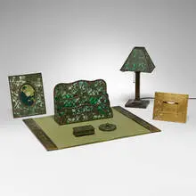 Grapevine desk set by Tiffany Studios, c. 1910, patinated bronze, gilt bronze, slag glass, sold Oct 2026