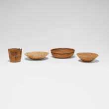 Collection of four baskets by Native American and Pakistani, woven plant fiber, sold Oct 2026