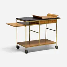 Irwin Collection bar cart, model 9203 by Paul McCobb, 1952, laminate, brass-plated steel, mahogany, casters, sold Sep 2026
