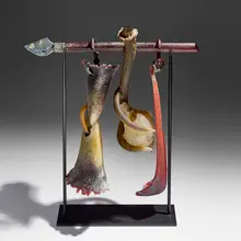 Suspended Artifact by William Morris, 1995, hand-blown and hot-sculpted glass, steel base, sold Sep 2026