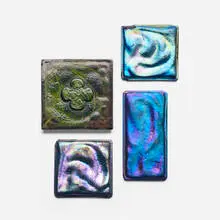 Collection of four tiles by Tiffany Studios, c. 1910, Favrile glass, sold Sep 2026