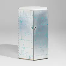 Hexagonal cabinet by Phillip Lloyd Powell, c. 1975, silver leaf over painted wood, granite, chrome-plated brass, sold Sep 2026