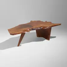 Slab coffee table by George Nakashima, 1960, English walnut, American black walnut, sold Sep 2026