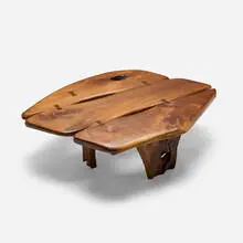 Coffee table by Phillip Lloyd Powell, 1979, walnut, wenge, rosewood, brass, sold Sep 2026